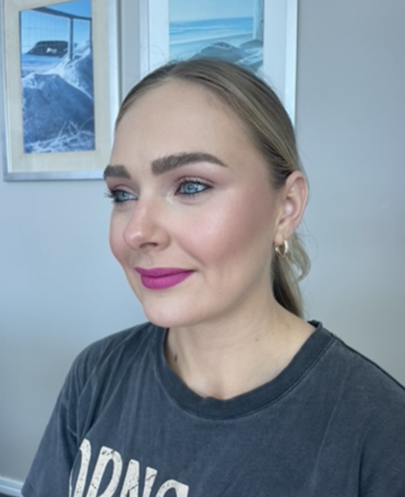 Mauve eye and magenta lip with slick ponytail