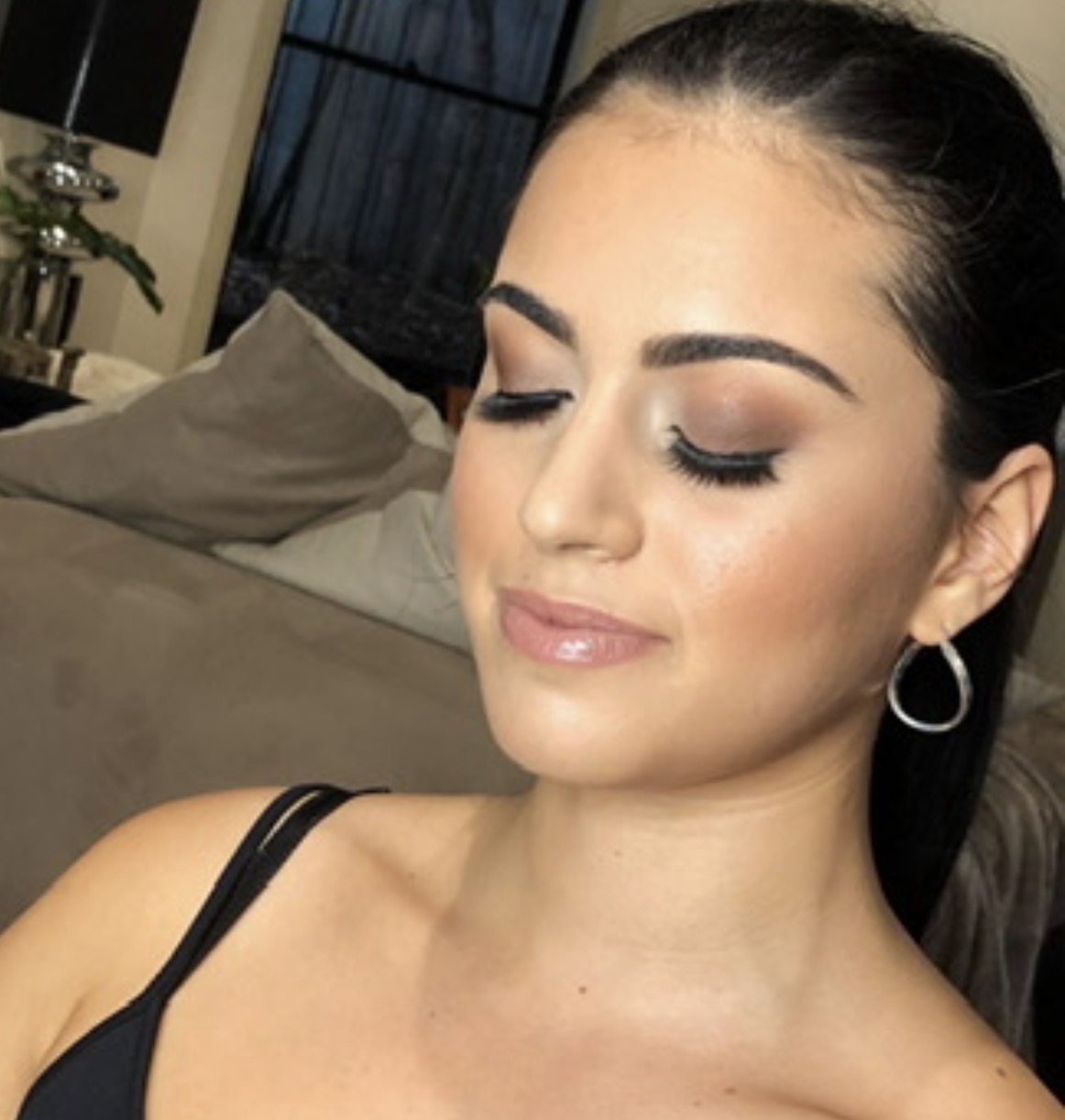 Bronzed smoky eye with glossy nude lip